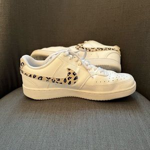 Womens 8.5 Nike with leopard print swoosh